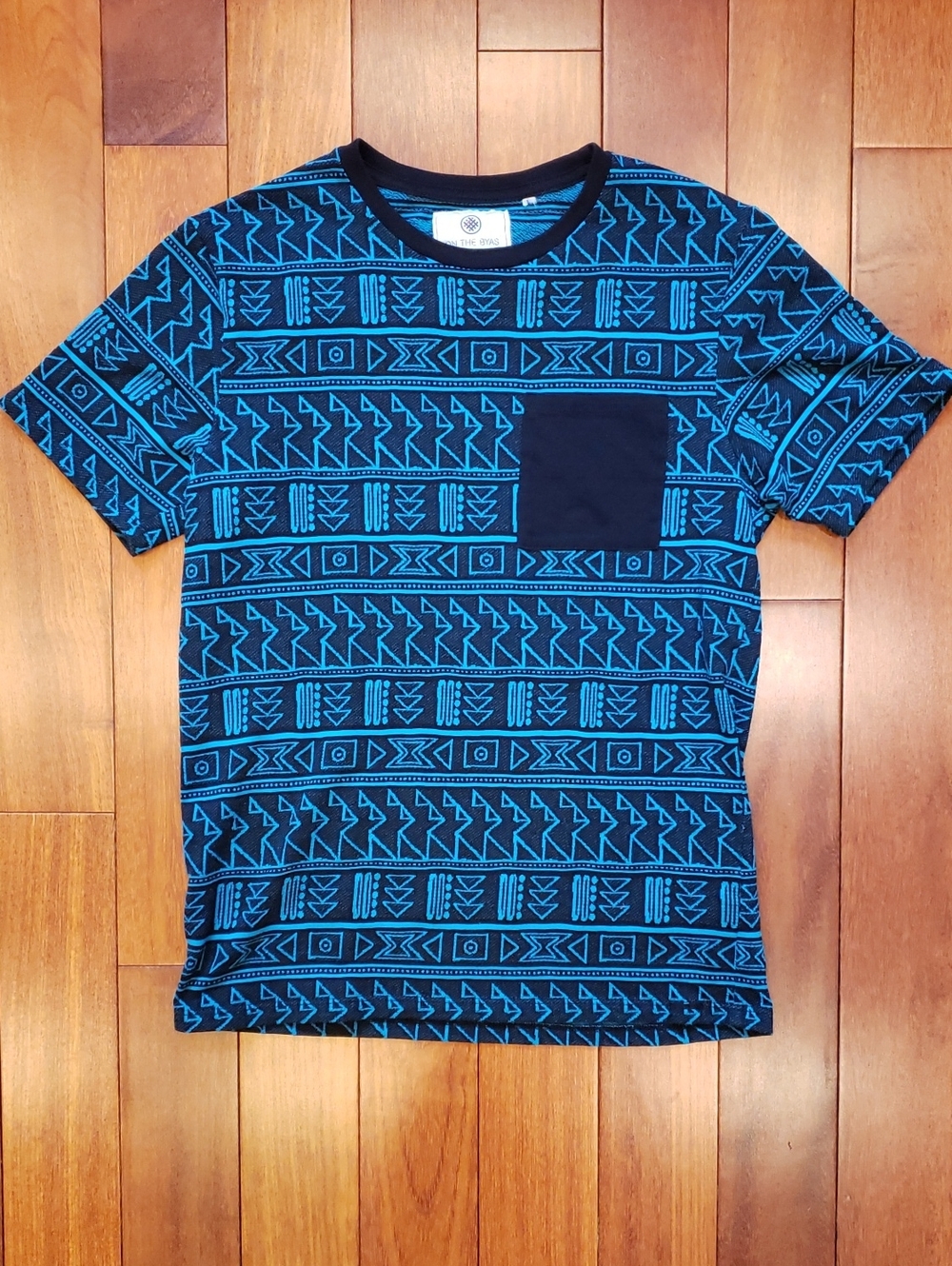 On the Byas Men's Small Tshirt. Geometrical design